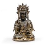 A Chinese bronze figure of Guanyin Ming dynasty The Bodhisattva seated in Padmasana with hands ...