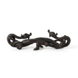 A Chinese bronze 'double-chilong' brush rest Yuan dynasty Cast as a pair of chi-dragons in oppo...
