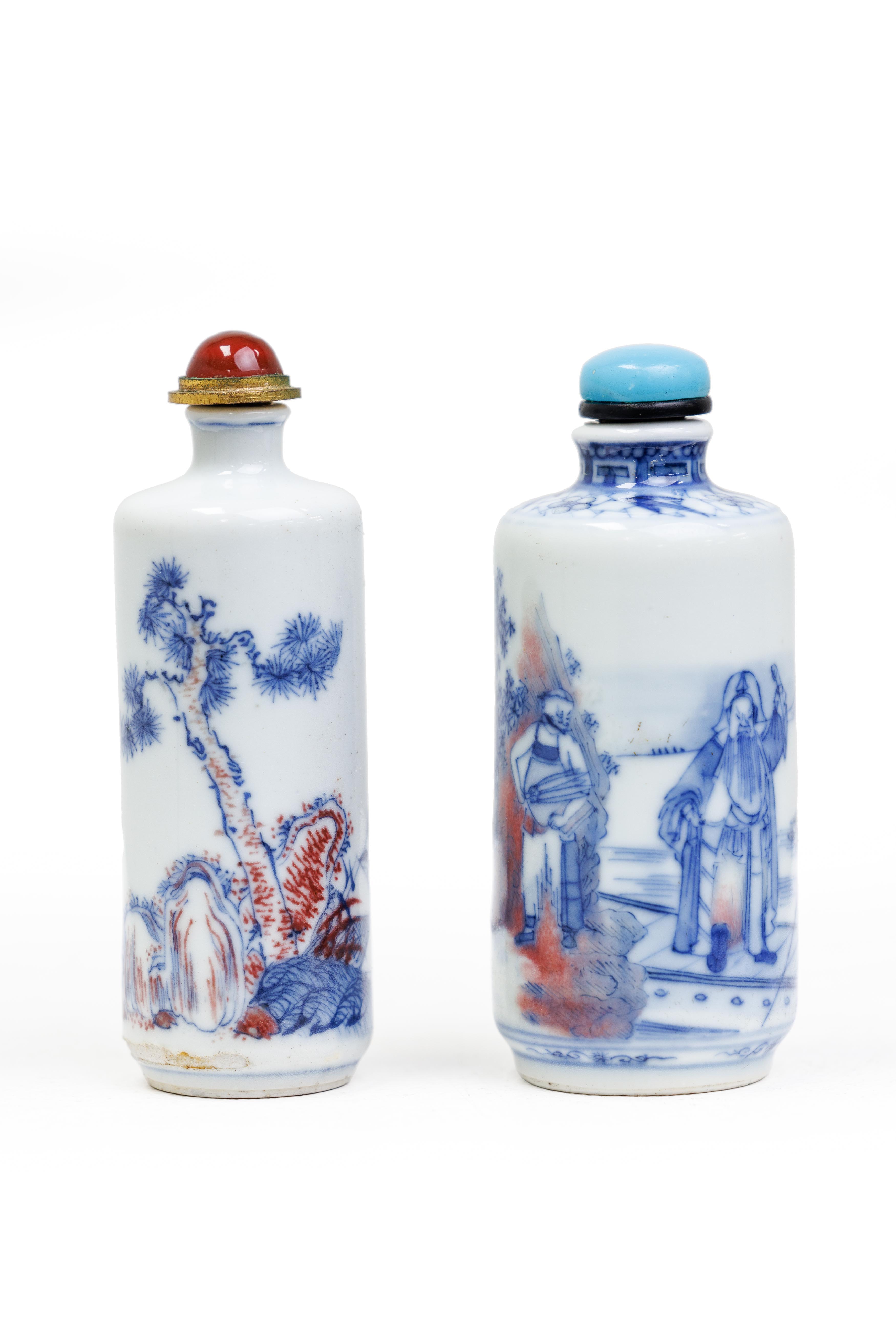 Two Chinese underglaze red and blue cylindrical snuff bottle Late Qing dynasty The first finely...