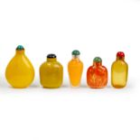 Five Chinese glass snuff bottles 20th century Comprising: a translucent overlay on orange glass...