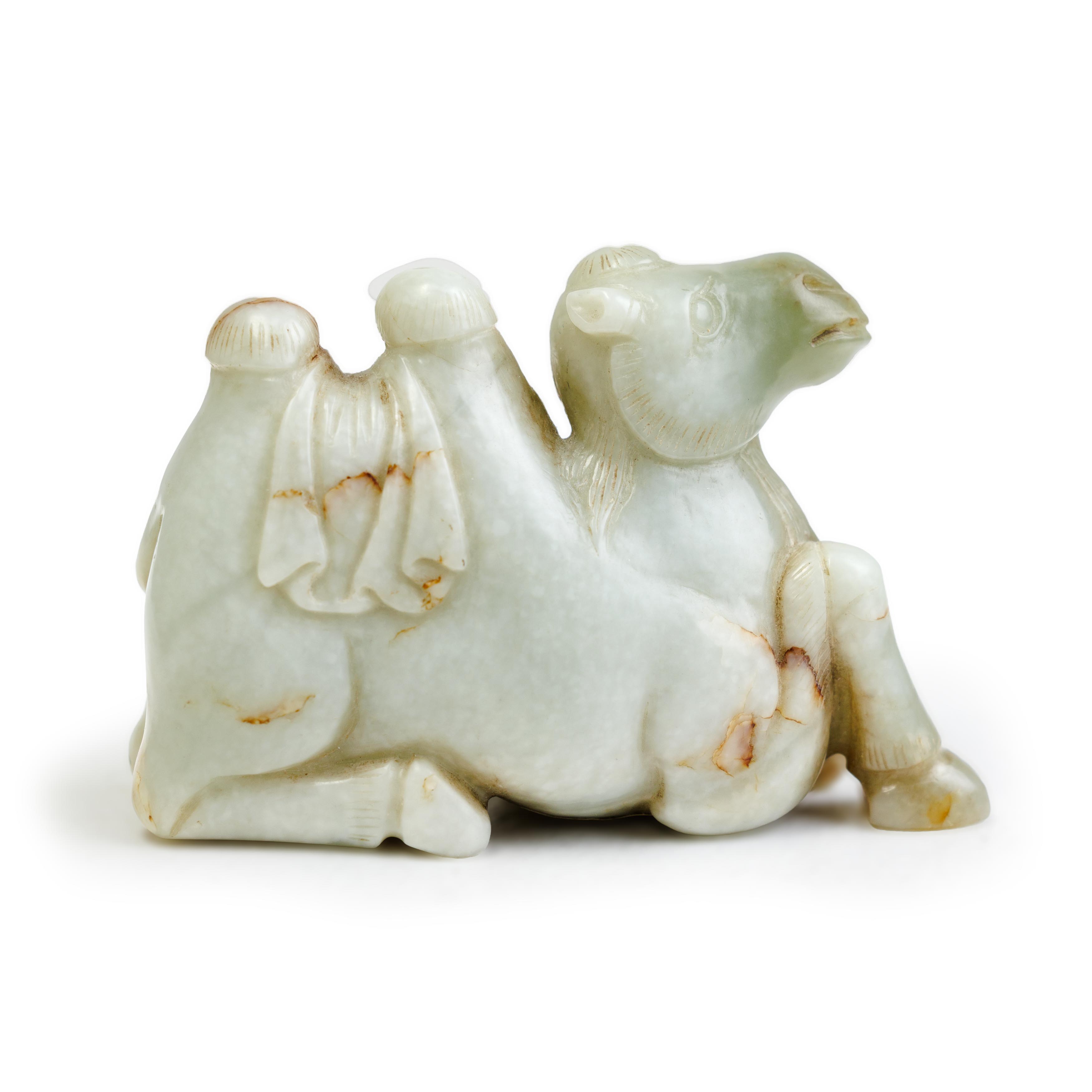 A Chinese green and mottled white jade carving of a camel 20th century The animal carved recumb...