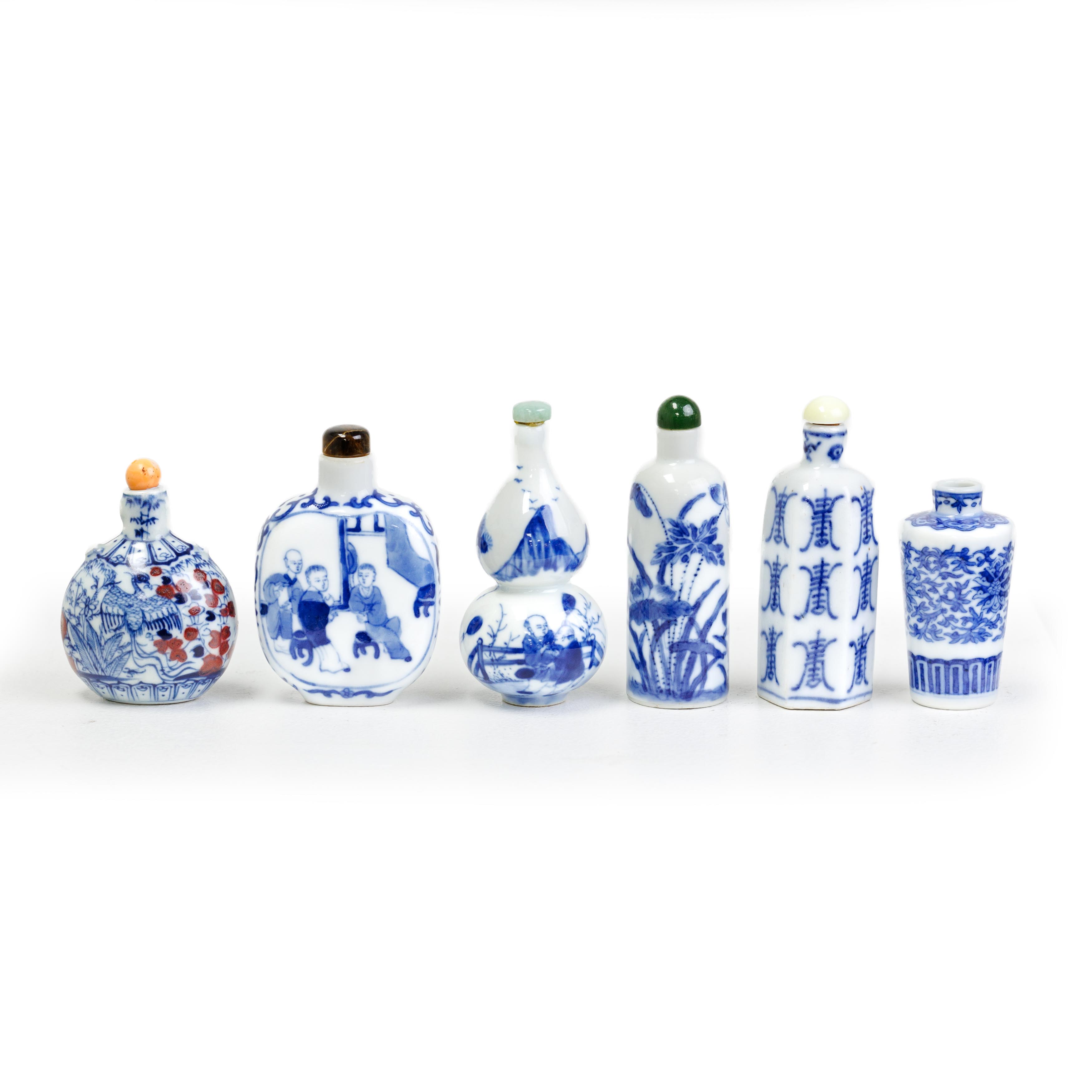 Five Chinese blue and white and one blue and white and underglaze red snuff bottle Late Qing dyn...