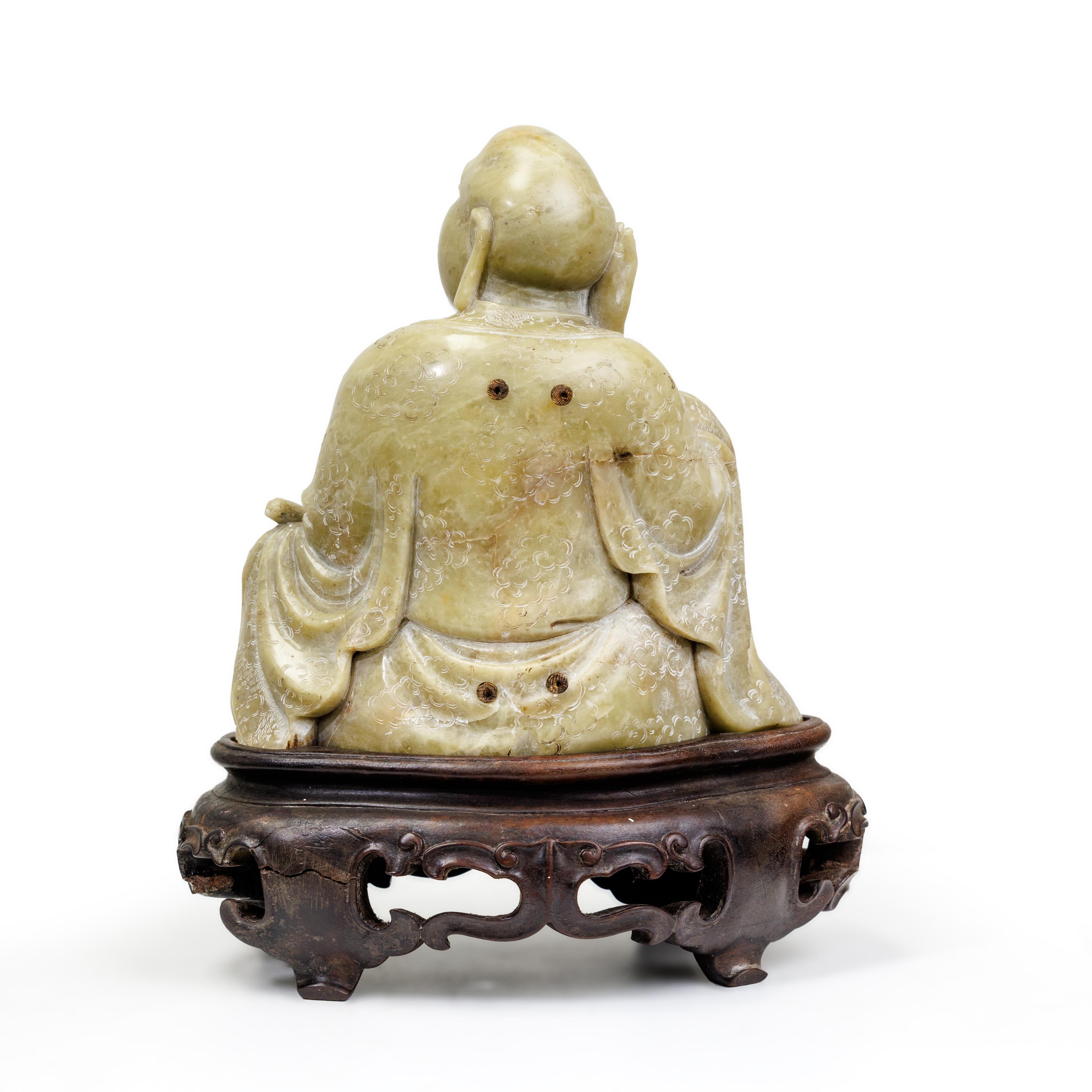 A Chinese soapstone carving of a luohan Qing dynasty The seated figure clad in thickly-folded r... - Image 2 of 2