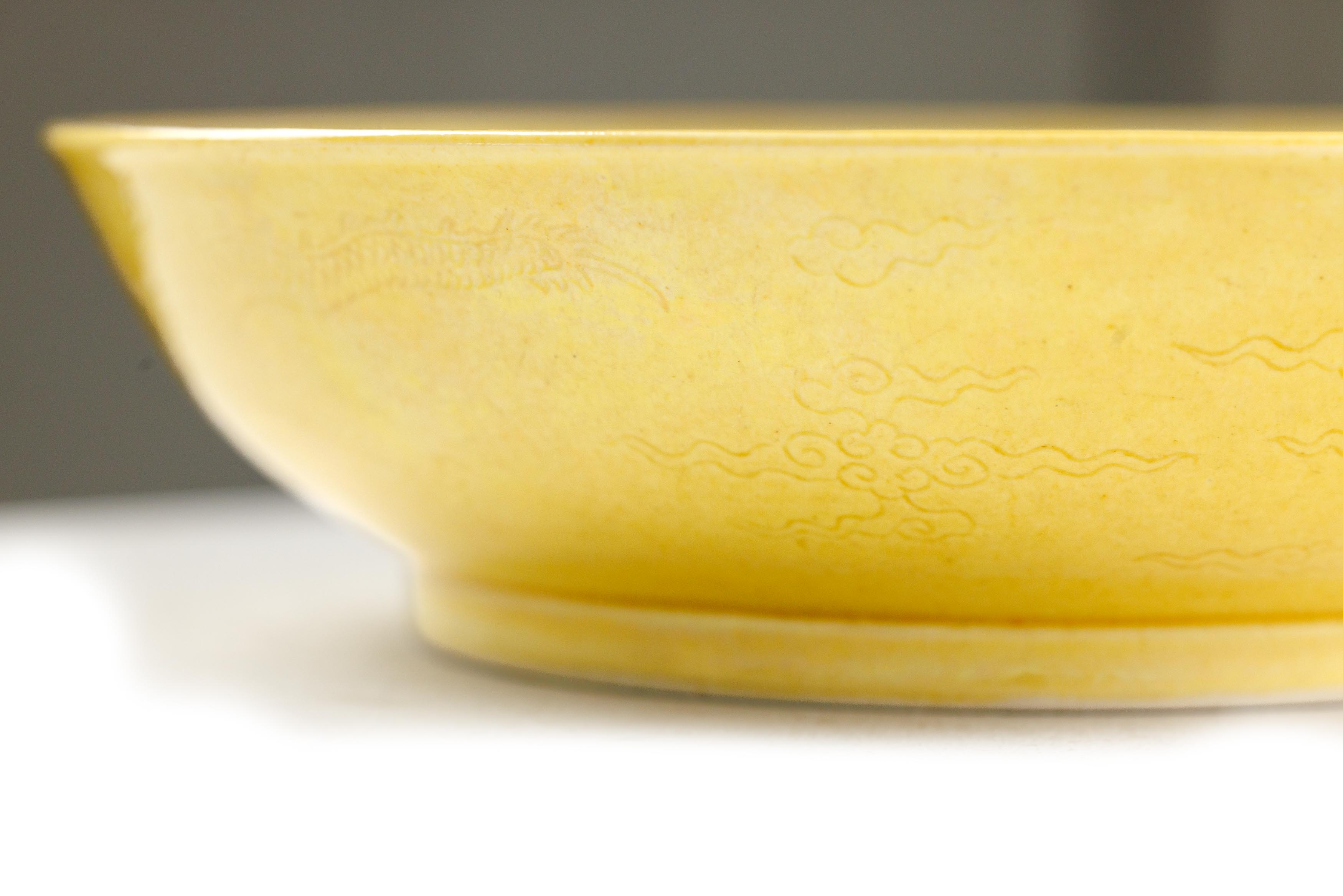 A Chinese yellow glazed 'dragon' dish Qing dynasty, Daoguang mark and period The deep dish with... - Image 5 of 7