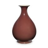 A Chinese copper red glazed bottle vase, yuhuchun Qing dynasty, Qianlong mark and period The ro...