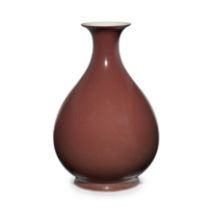 A Chinese copper red glazed bottle vase, yuhuchun Qing dynasty, Qianlong mark and period The ro...
