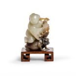 A Chinese two colour jade carving of Liu Hai and his three-legged toad Qing dynasty, Jiaqing per...