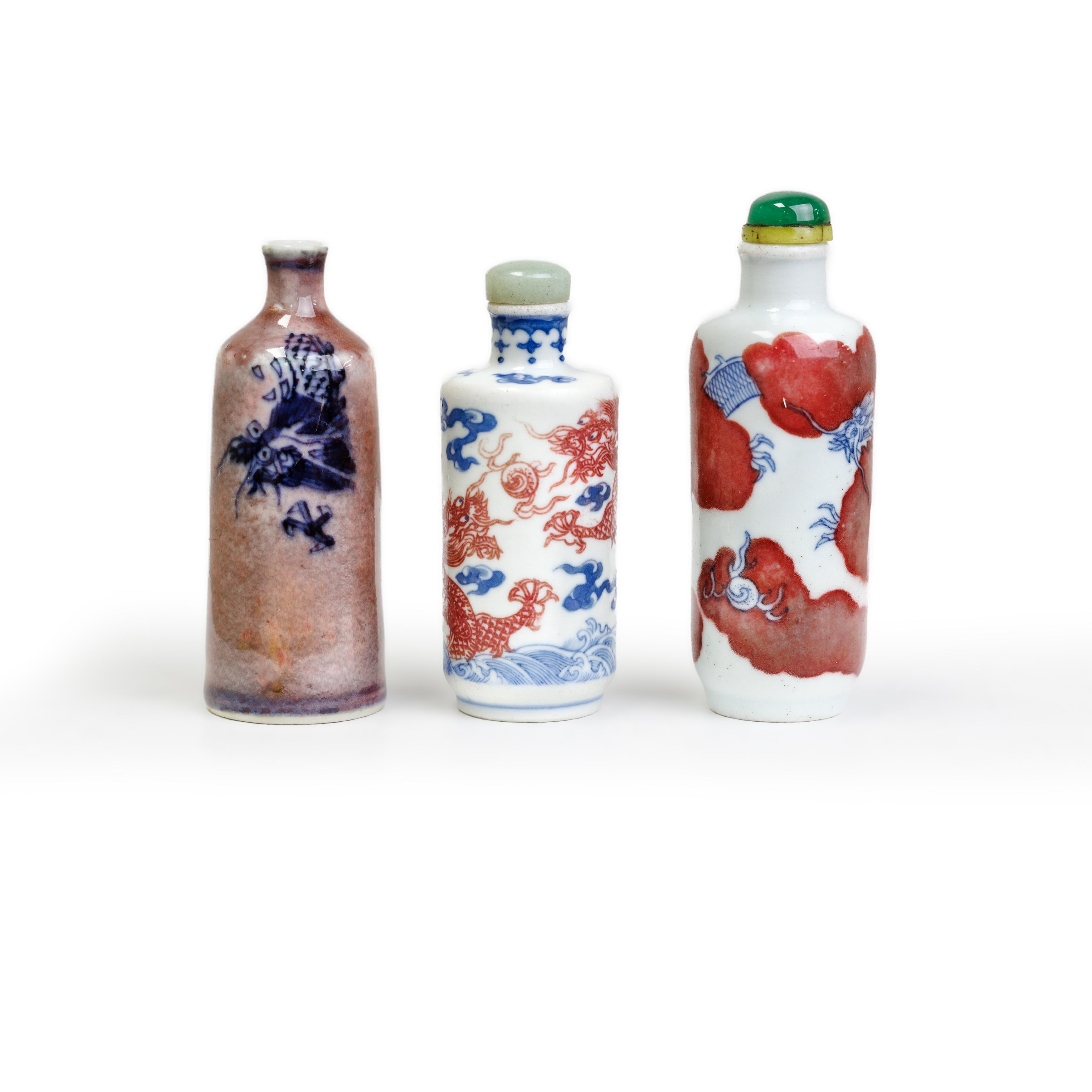 Three Chinese copper-red and blue and white 'dragon' snuff bottles Late Qing dynasty The first ...