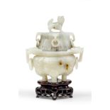 A Chinese carved jade twin handled incense burner and cover Late Qing Dynasty Of flattened lobe...