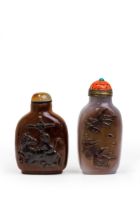 Two Chinese carved agate snuff bottles Qing dynasty, 19th century The first, from a greyish sto...