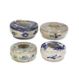 Four Annamese blue and white water pots 16th century Each of drum form and painted with floral...