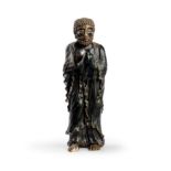 A Japanese brown-glazed pottery figure of an emaciated Buddhist monk 19th/20th century Standing...