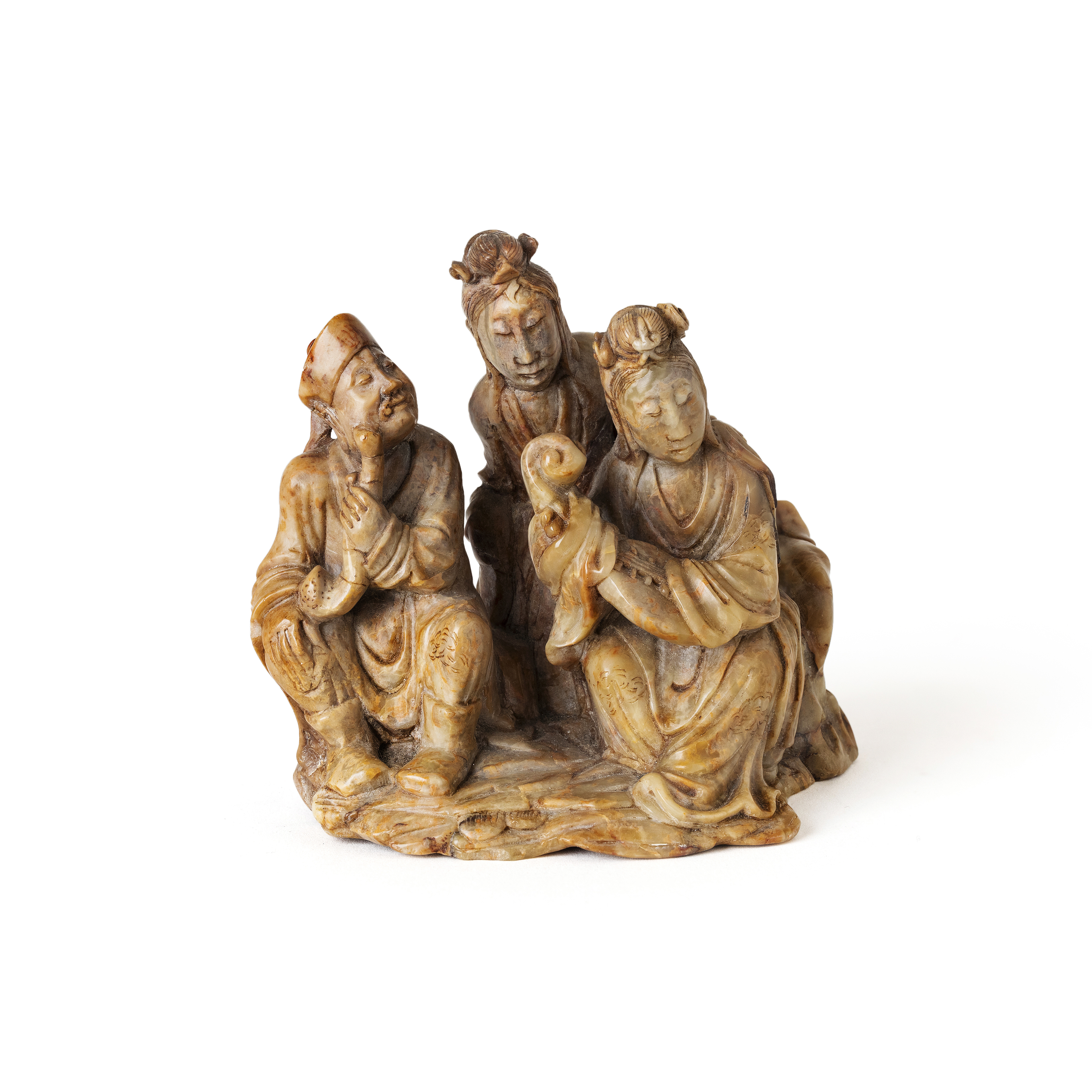 A Chinese soapstone 'musicians' group Late Qing dynasty Carved as two lady and one male musicia...