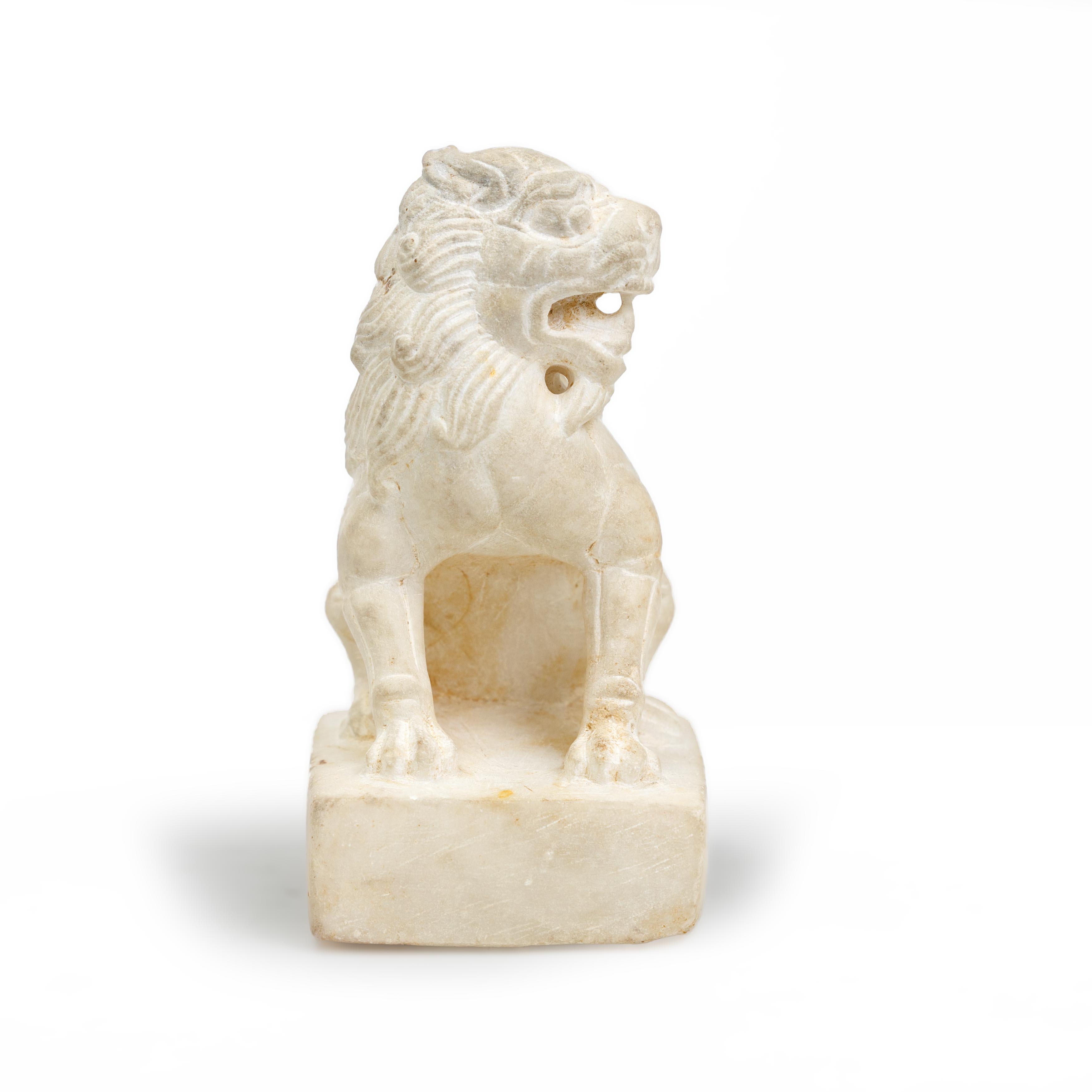 A small Chinese carved marble lion Tang dynasty Seated on a rectangular plinth, the beast carve... - Image 2 of 2