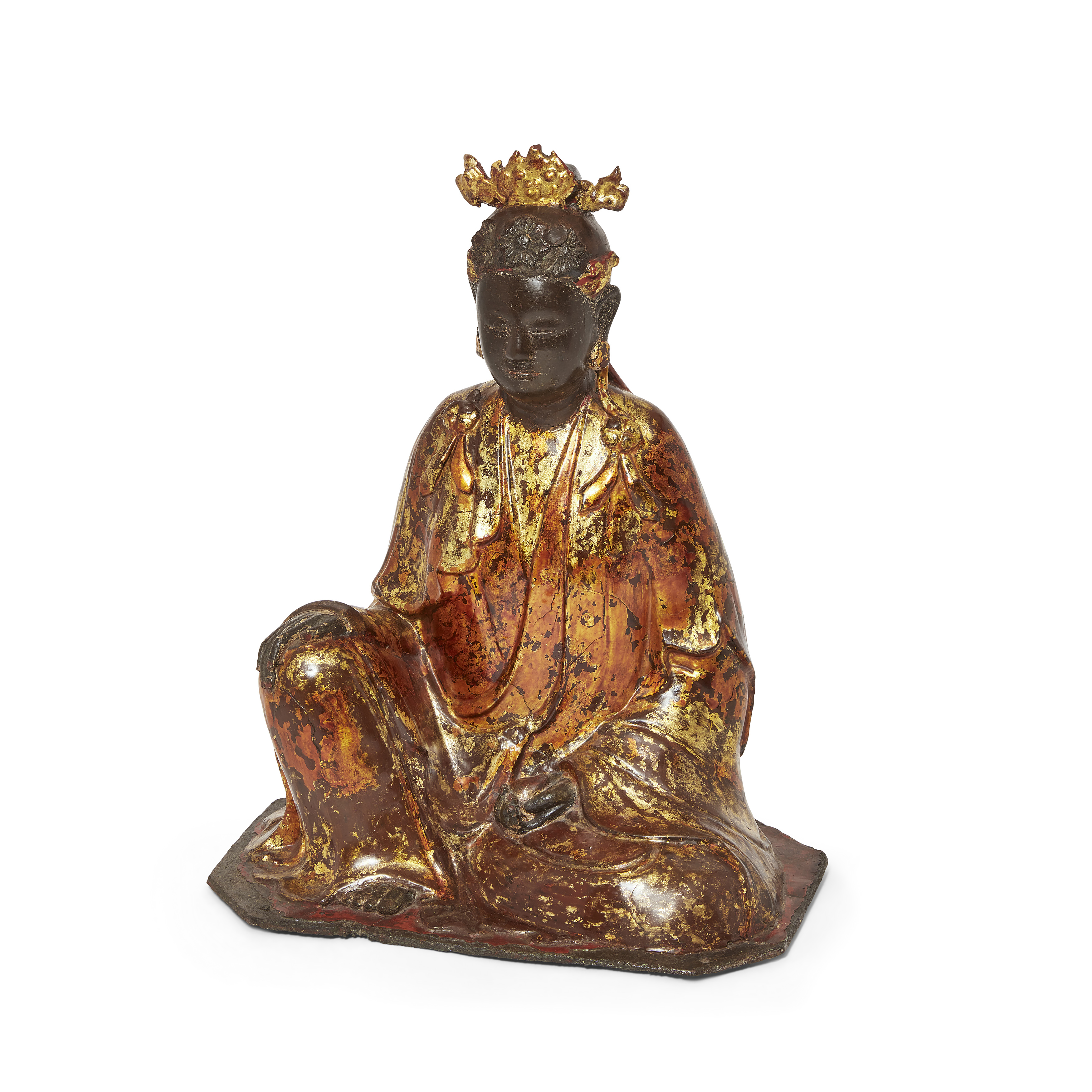 A Chinese lacquered bronze figure of Guanyin 17th/18th century Cast seated in elegant pose, her...