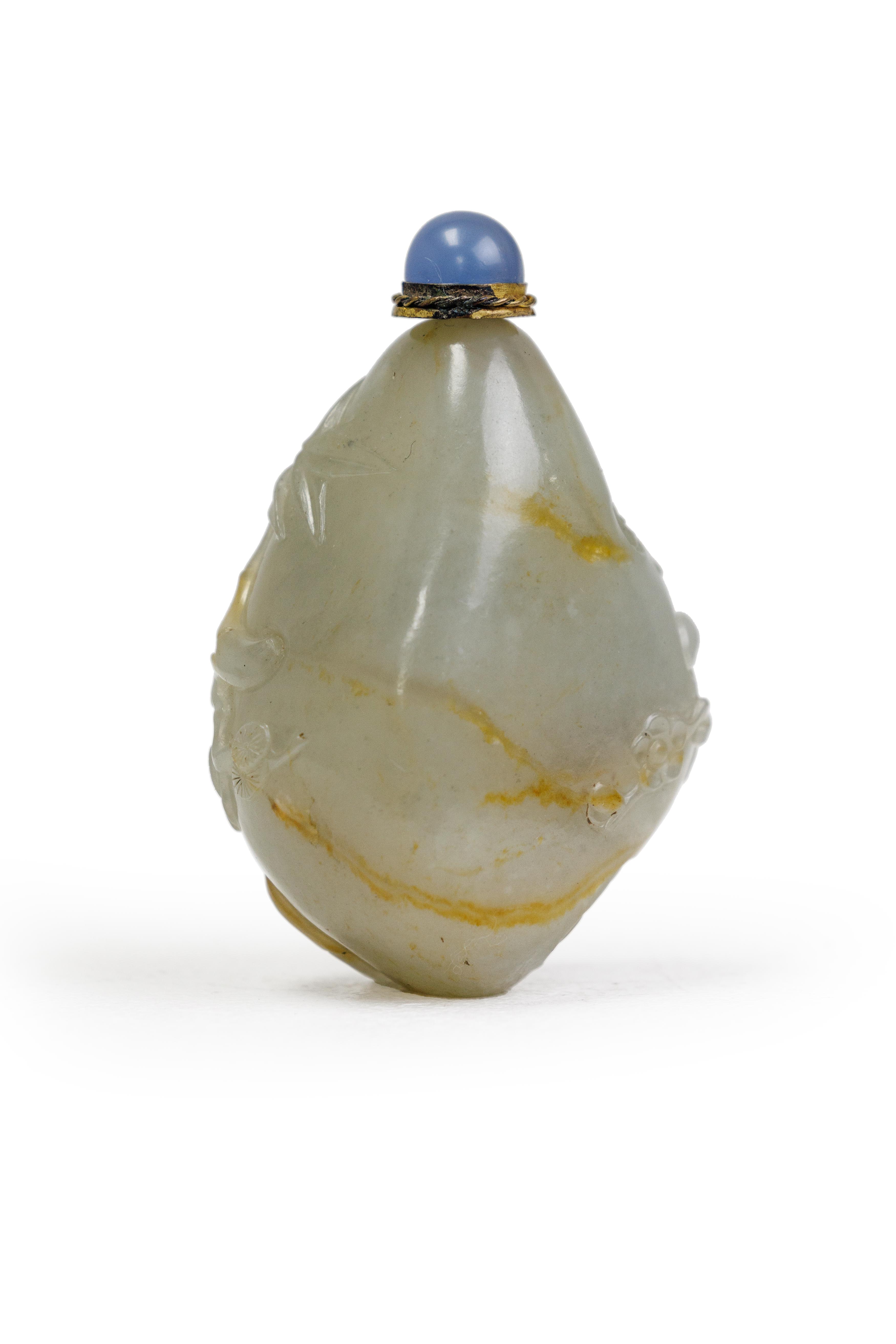 A Chinese pale green and russet jade 'Three Friends of Winter' pebble-form snuff bottle Qing dyn... - Image 2 of 2