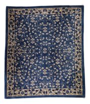 A Chinese blue ground Peking carpet North China Circa 1900 The blue field with scrolling foliag...