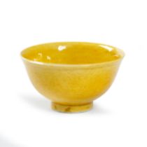 A Chinese monochrome yellow 'dragon' wine cup Republic period Incised to the exterior with two ...