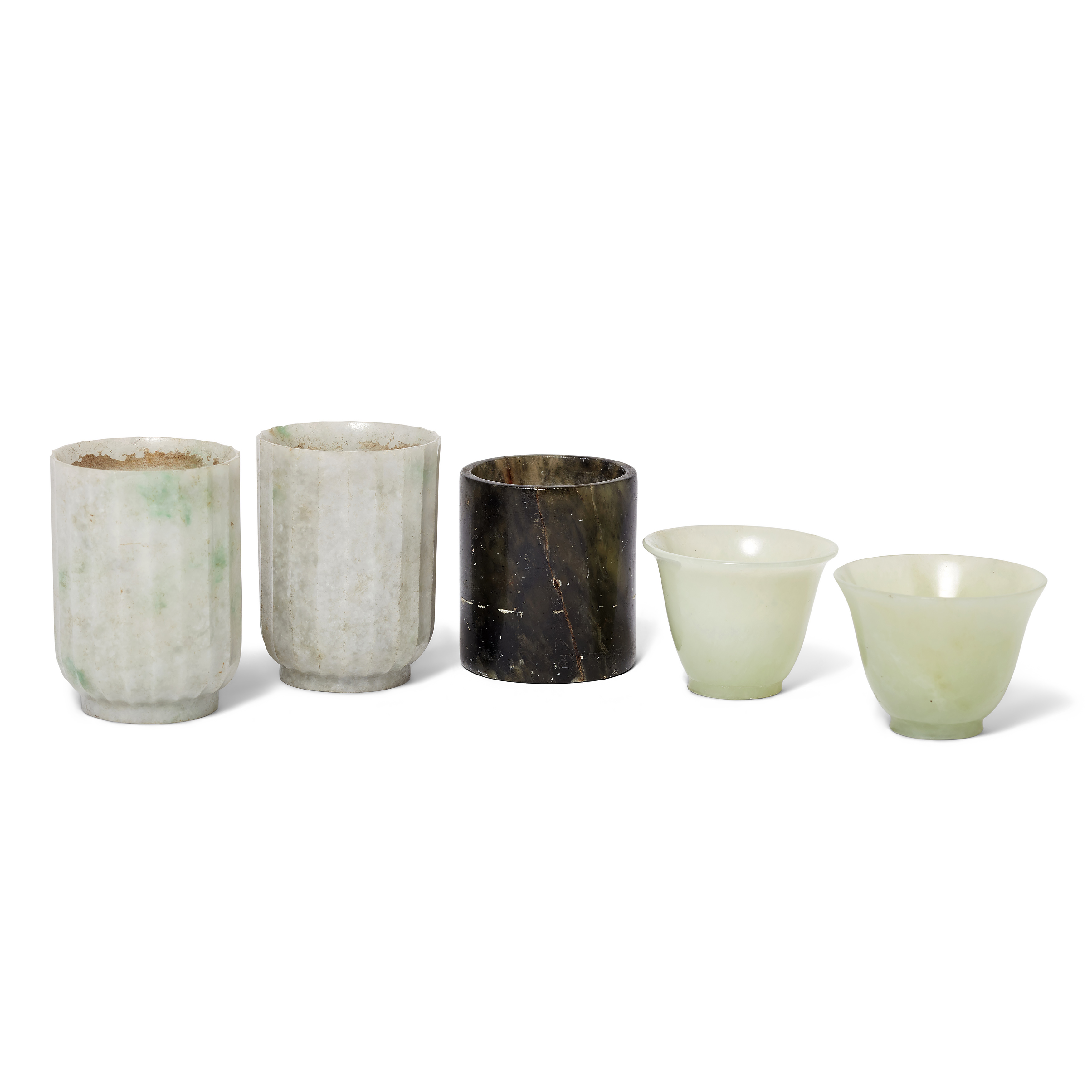 Five Chinese jadeite and hardstone vessels Qing dynasty, 19th century Comprising: a pair of flu...