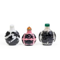 Three Chinese black overlay snuff bottles Qing dynasty, 19th century Comprising: a black overla...
