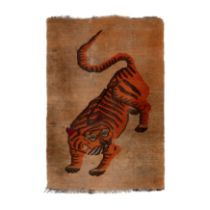 A Tibetan 'Tiger' rug 19th century 134cm x 89cm. Provenance: collection of Mimi Lipton, purcha...