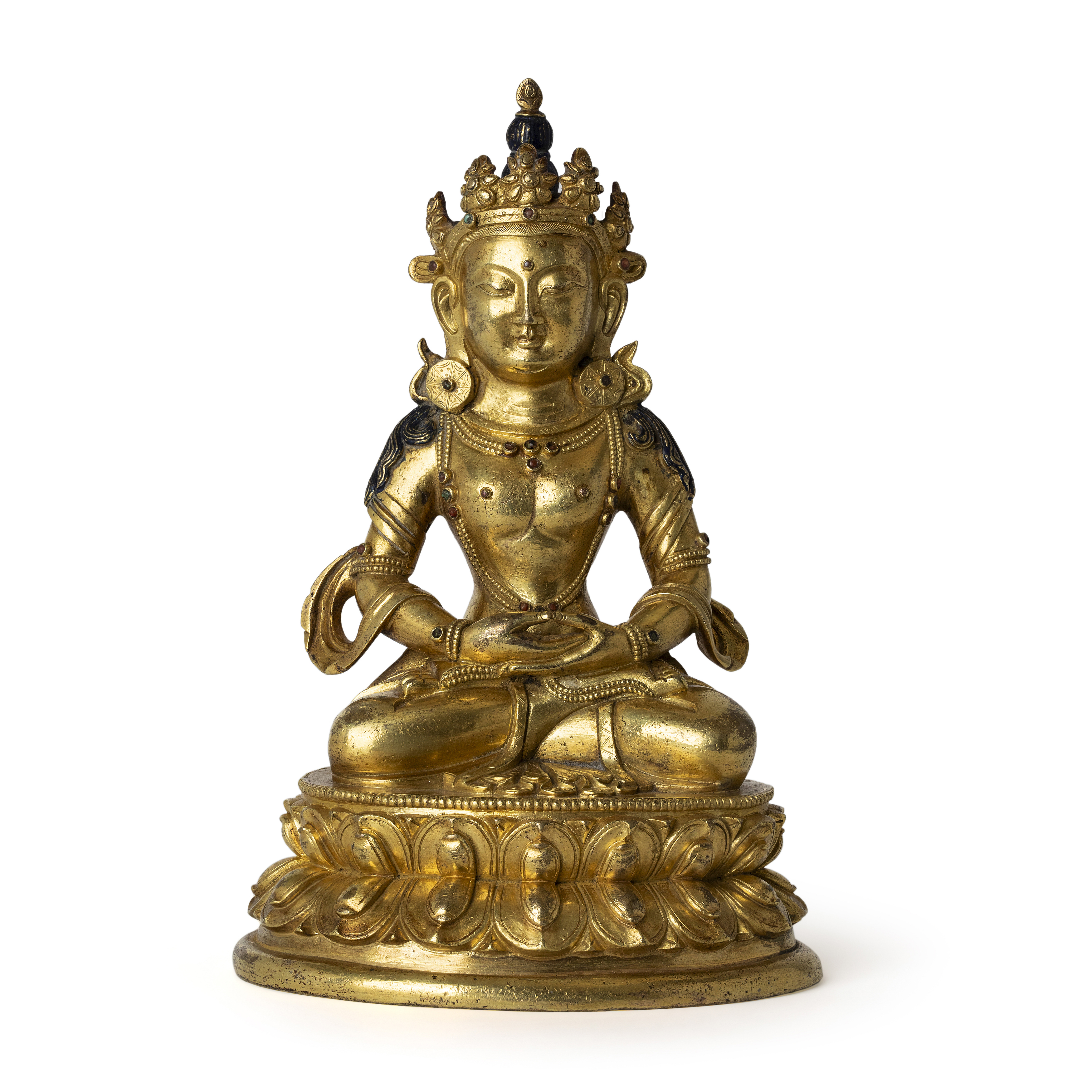 A Sino-Tibetan gilt bronze Bodhisattva 18th century The heavily casted figure seated on a waist...
