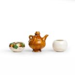 A group of three Chinese miniature vessels Tang dynasty Comprising an amber-glazed water-droppe...