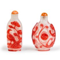 Two Chinese red overlay snowstorm glass snuff bottles Qing dynasty, 19th century One carved wit...
