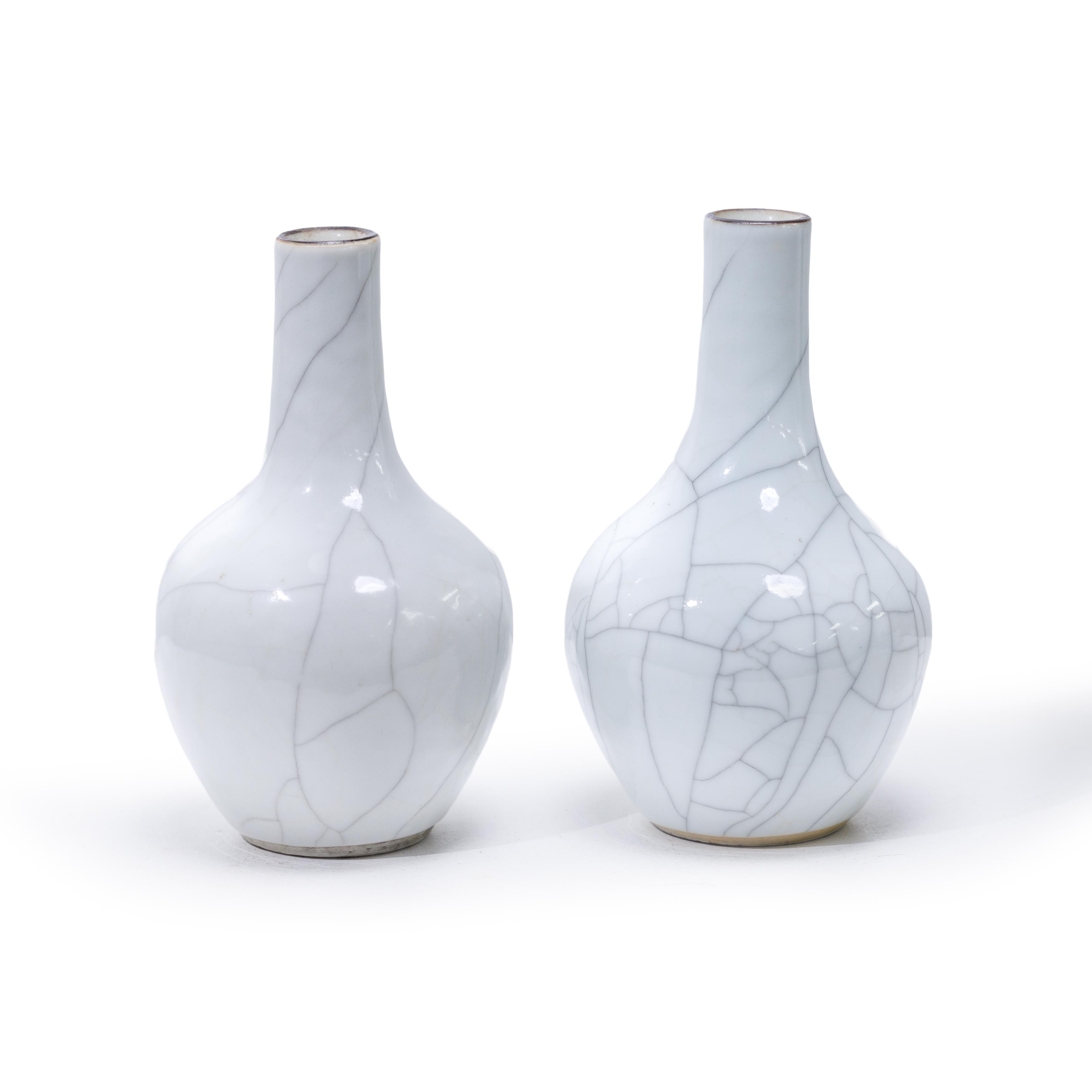 A pair of Chinese ge type bottle vases Late Qing dynasty/Republic period Covered in a pale grey...
