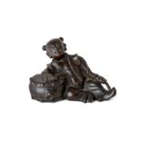 A Chinese bronze 'boy drummer' paper weight Ming dynasty Cast as a boy reclining against a drum...