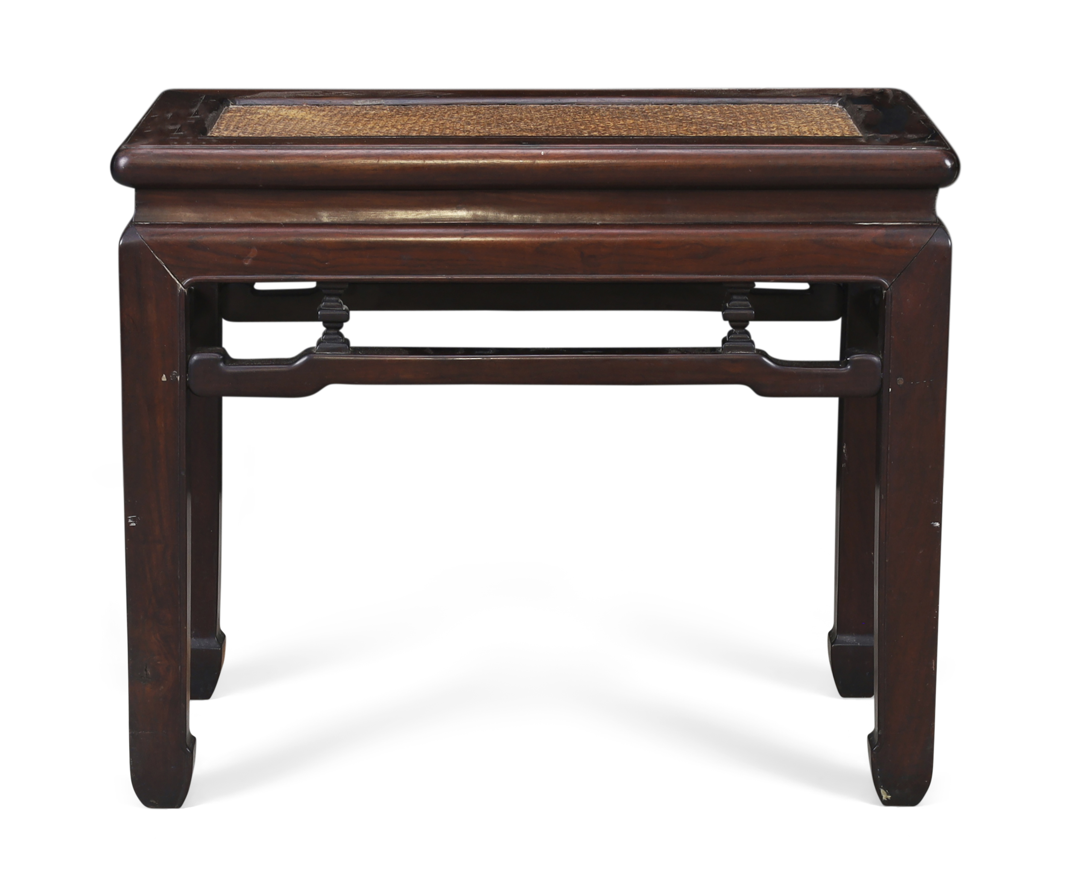 A Chinese hongmu bench, Qing dynasty, 19th century The rectangular top with soft caned seat abo...