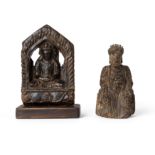 A Chinese wood carving of a seated Daoist deity, and a Himalayan lacquered wood stele of a seated...