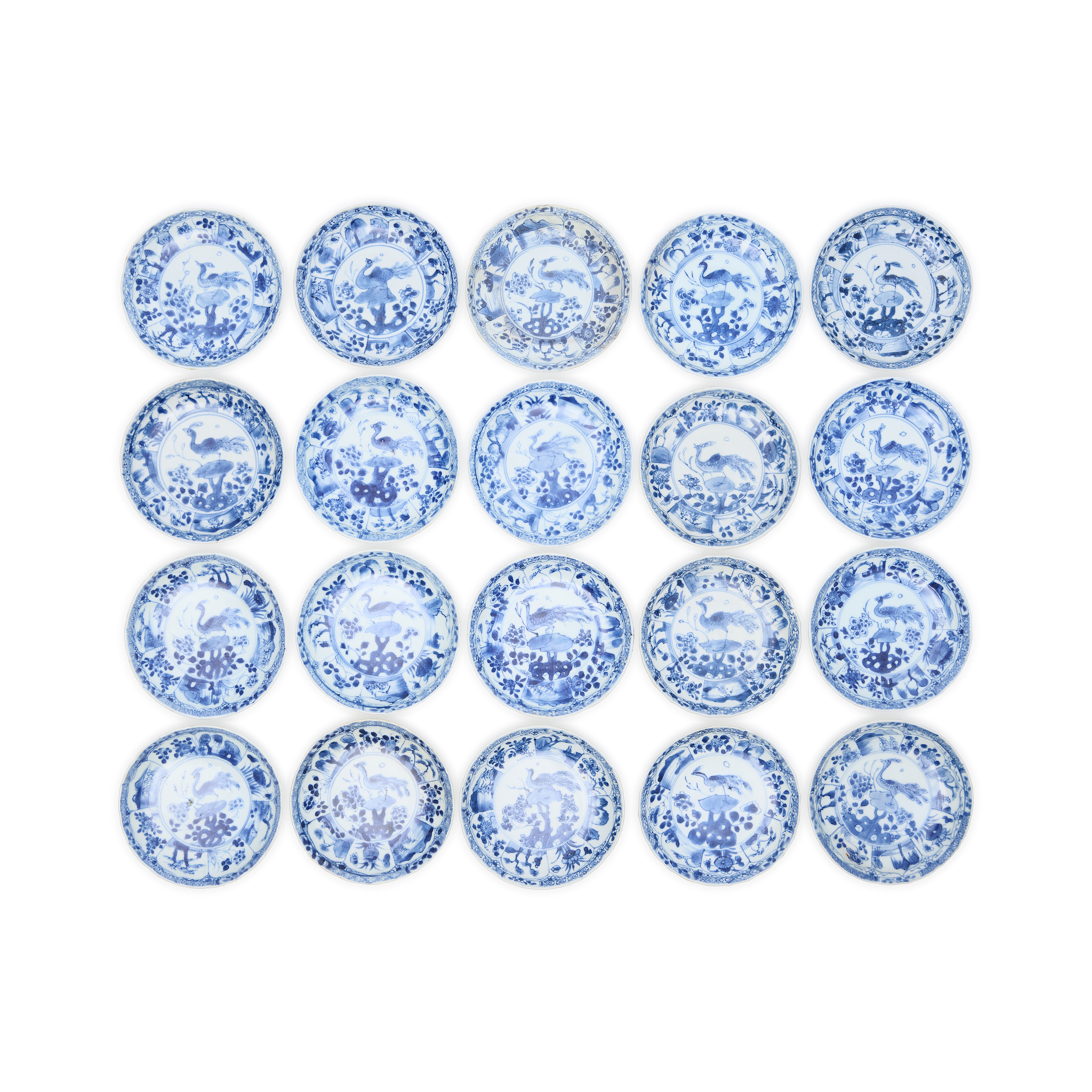 Twenty Chinese blue and white 'peacock' saucer dishes excavated from the Ca Mau shipwreck Qing d...