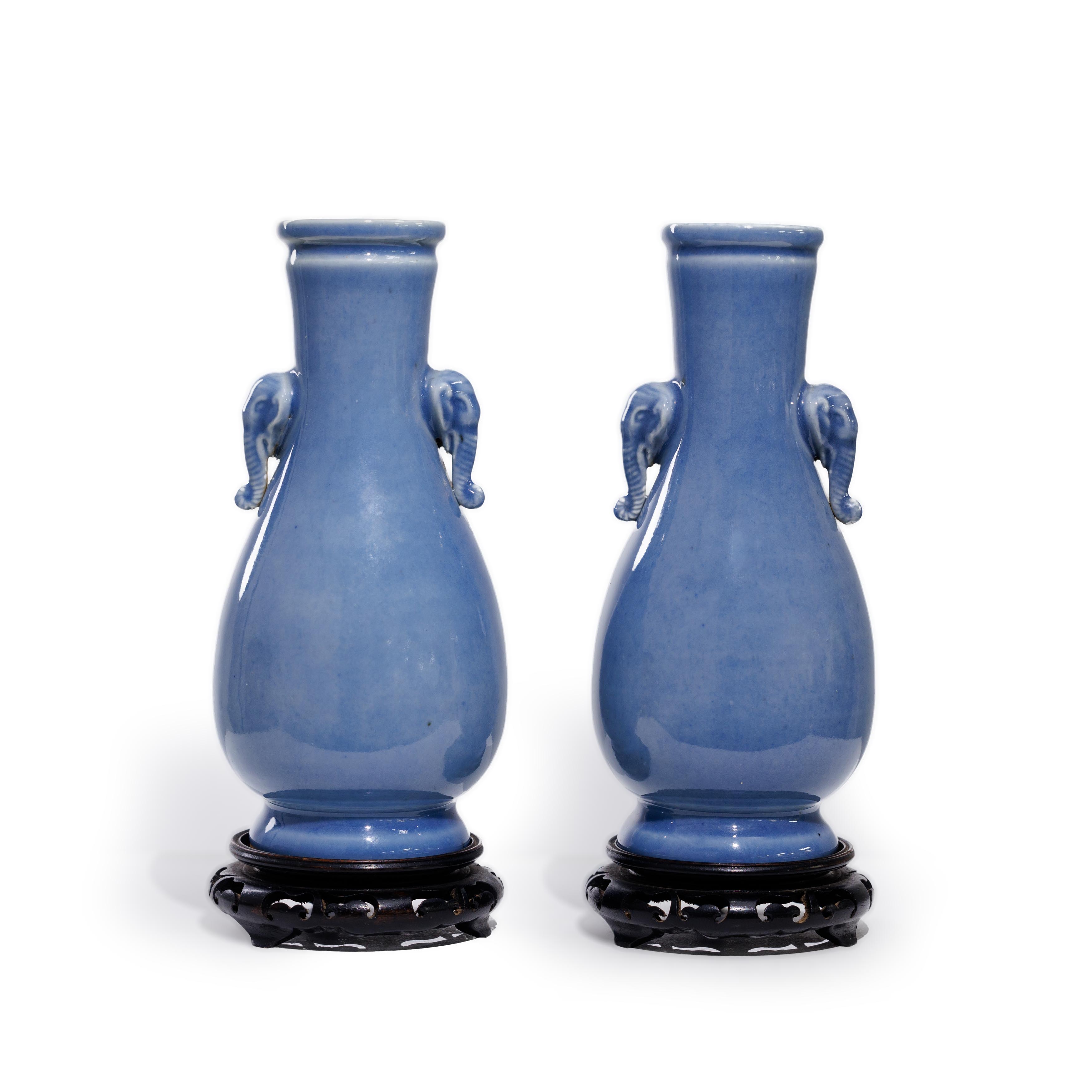 A pair of Chinese monochrome blue glazed vases Late Qing dynasty The slender necks moulded with...