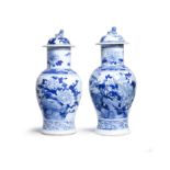 A pair of large Chinese blue and white vases and covers Qing dynasty, 19th century Decorated to...