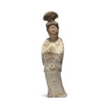 A Chinese painted pottery figure of a court lady Tang dynasty With thickly-painted eyebrows and...