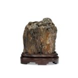A Chinese scholar's rock 20th century Made from a piece of petrified wood to simulate a craggy ...