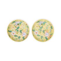 A pair of Chinese yellow ground famille rose dishes Qing dynasty, 19th century Raised on short ...