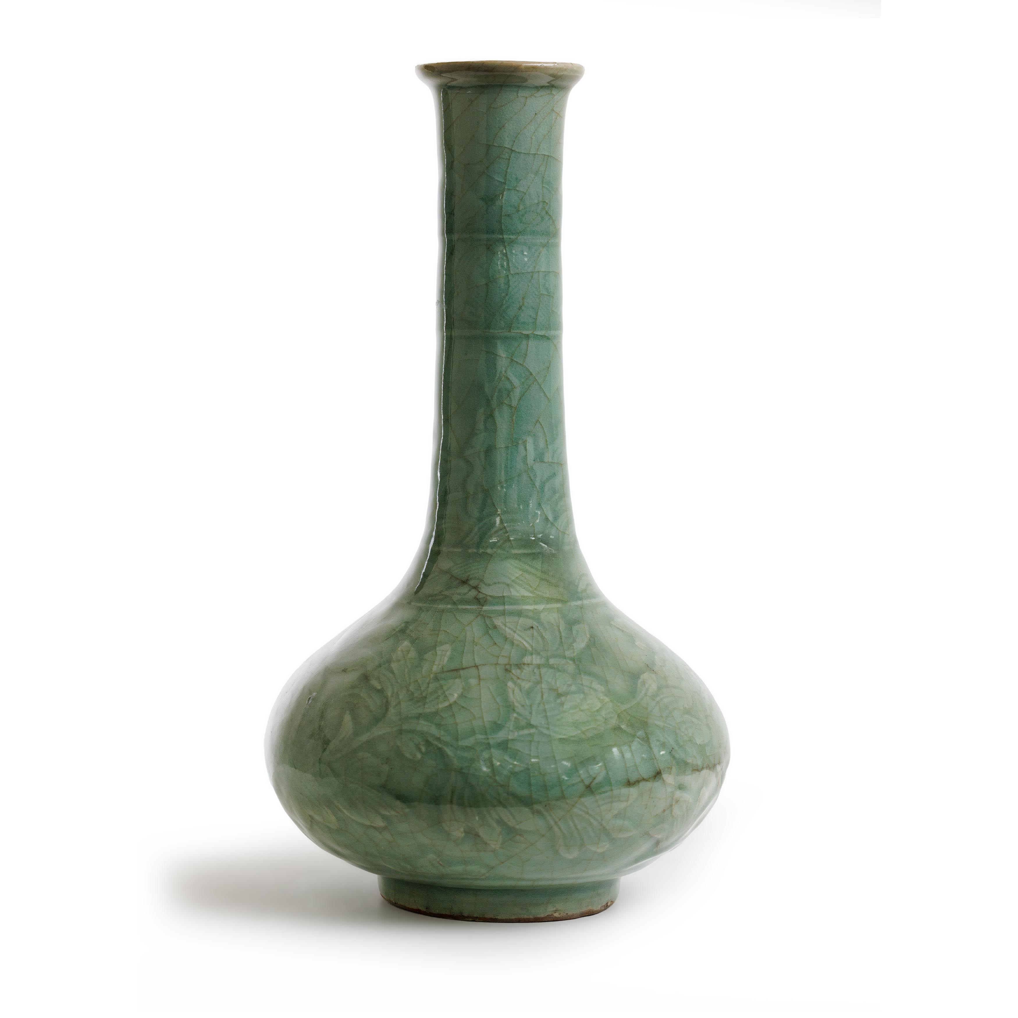 A Chinese Longquan celadon moulded and carved bottle vase Ming dynasty The heavily potted vase ...
