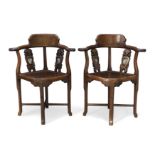 A pair of Chinese hongmu corner chairs, Early 20th century Each with two carved splats set with...