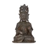 A Chinese bronze figure of Guanyin Ming dynasty The Bodhisattva seated in Padmasana with hands ...