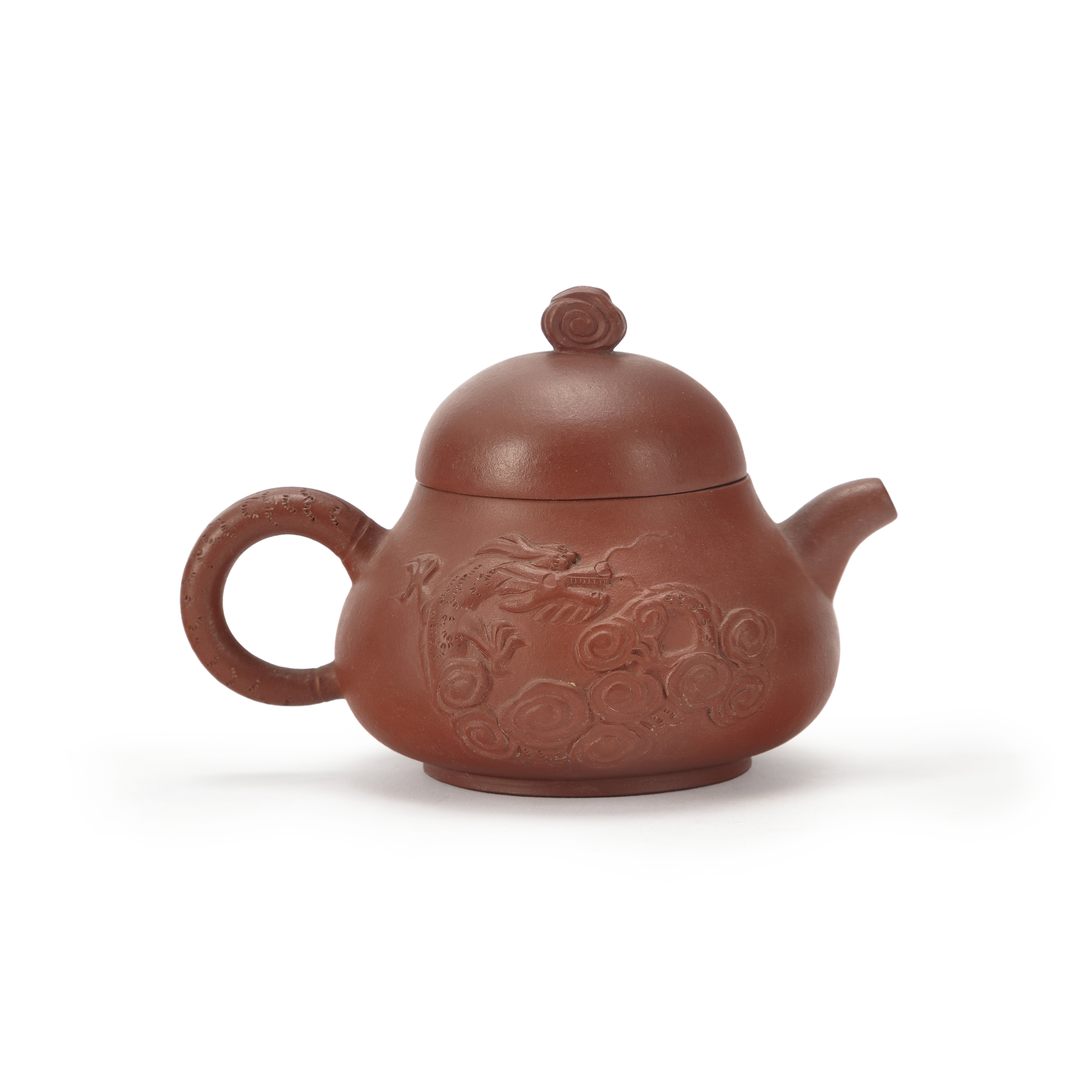 A Chinese Yixing 'dragon' teapot 20th century The teapot of compressed pear shaped form with a ...