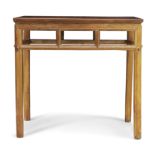 A Chinese rosewood side table Late Qing dynasty The rectangular top above open frieze raised on...