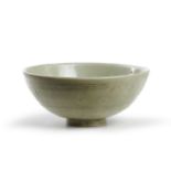 A Chinese Longquan grey stoneware celadon bowl Ming dynasty Covered in a pale olive green glaze...