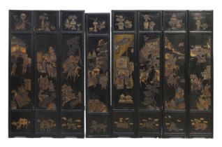A large Chinese eight section folding screen Republic period Carved and painted to both sides w...