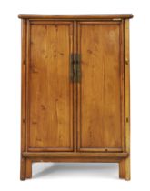 A Chinese elm cabinet Early 20th century With pair of rectangular panel doors and central stile...