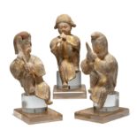 A group of three Chinese parcel gilt pottery musicians Tang dynasty Each modelled seated with o...