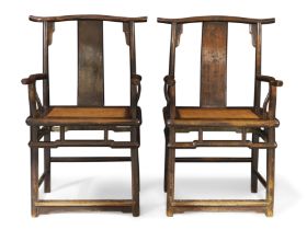 A pair of Chinese provincial lacquered elm yoke back armchairs, Qing dynasty, 18th century With...