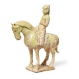 A Chinese pottery straw glazed figure of a horseman Sui dynasty The horse standing four square ...