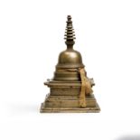 A Chinese copper-alloy stupa Yuan/Ming dynasty Typically cast as a stepped square-section plint...